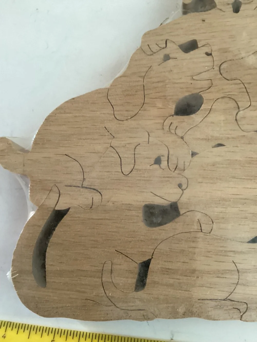 Hans Wooden Dog Shapes puzzle  9 pieces of dogs, bones and a ball